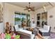 Comfortable screened patio with wicker furniture and sliding glass doors at 13033 N Marsh Dr, Port Charlotte, FL 33953