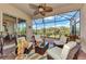 Relaxing screened patio with wicker furniture and view of nature at 13033 N Marsh Dr, Port Charlotte, FL 33953