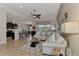 Open living room with comfy sectional sofa and kitchen view at 13033 N Marsh Dr, Port Charlotte, FL 33953