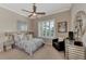 Guest bedroom with a ceiling fan and comfortable seating at 13033 N Marsh Dr, Port Charlotte, FL 33953