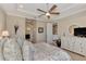 Spacious bedroom with a ceiling fan, dresser, and large bed at 13033 N Marsh Dr, Port Charlotte, FL 33953