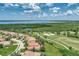 Aerial view of a luxury waterfront community with golf course at 13392 Golf Pointe Dr, Port Charlotte, FL 33953