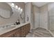 Double vanity bathroom with walk-in shower at 2844 Myakka Creek Ct, Port Charlotte, FL 33953