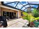 Spacious screened lanai with a hot tub and plenty of room for entertaining at 2844 Myakka Creek Ct, Port Charlotte, FL 33953