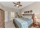 King-size bed in tranquil bedroom with ensuite bath at 2844 Myakka Creek Ct, Port Charlotte, FL 33953