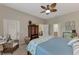 Bedroom with wicker furniture and access to bathroom at 2844 Myakka Creek Ct, Port Charlotte, FL 33953