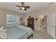 Main bedroom with ceiling fan and large windows at 2844 Myakka Creek Ct, Port Charlotte, FL 33953