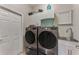 Laundry room with modern washer and dryer, and utility sink at 2844 Myakka Creek Ct, Port Charlotte, FL 33953