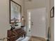 Bright entryway with a console table, nautical map, and access to other rooms at 2844 Myakka Creek Ct, Port Charlotte, FL 33953
