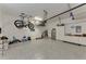 Spacious garage with epoxy flooring, storage racks, and room for two cars at 2844 Myakka Creek Ct, Port Charlotte, FL 33953