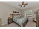 Spacious bedroom with ceiling fan and ensuite bathroom at 2844 Myakka Creek Ct, Port Charlotte, FL 33953
