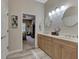 Elegant bathroom with double sinks, large mirrors, and updated fixtures at 2844 Myakka Creek Ct, Port Charlotte, FL 33953