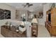 Open concept living room with comfortable seating and views to kitchen at 2844 Myakka Creek Ct, Port Charlotte, FL 33953