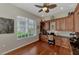 Well-equipped home office with built-in cabinetry and hardwood floors at 2844 Myakka Creek Ct, Port Charlotte, FL 33953