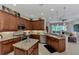 Spacious kitchen with granite countertops, island, and stainless steel appliances at 2844 Myakka Creek Ct, Port Charlotte, FL 33953