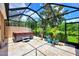 Relaxing hot tub in a screened lanai, perfect for enjoying the Florida weather at 2844 Myakka Creek Ct, Port Charlotte, FL 33953