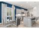 Kitchen with gray cabinets, granite island, and breakfast nook at 10985 Trevino St, Englewood, FL 34223