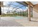 Relaxing screened pool and patio area with open views at 10985 Trevino St, Englewood, FL 34223