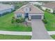 One-story home with tile roof and stone accents at 10985 Trevino St, Englewood, FL 34223