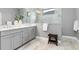 Elegant bathroom boasts double vanity and large walk-in shower at 10985 Trevino St, Englewood, FL 34223