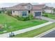 Beautiful home with landscaping and paver driveway at 10985 Trevino St, Englewood, FL 34223