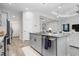 Modern kitchen island with granite countertops and stainless steel appliances at 10985 Trevino St, Englewood, FL 34223