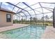 Enjoy this screened pool and lanai with paver deck at 10985 Trevino St, Englewood, FL 34223