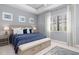Spacious main bedroom with ample natural light and stylish decor at 10985 Trevino St, Englewood, FL 34223