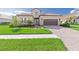 One-story home with tile roof and landscaped yard at 10985 Trevino St, Englewood, FL 34223