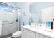 Clean bathroom with a walk-in shower and white vanity at 10985 Trevino St, Englewood, FL 34223