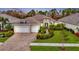 Luxury home with three-car garage and landscaped yard at 12424 Davie Ct, Venice, FL 34293