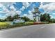 Grand Palm community entrance with attractive landscaping and signage at 12424 Davie Ct, Venice, FL 34293