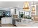 Kitchen with farmhouse sink, granite counters, and pool view at 12596 Bacchus Rd, Port Charlotte, FL 33981