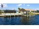 Private dock with covered boat lift and spacious waterfront access at 12596 Bacchus Rd, Port Charlotte, FL 33981