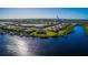 Aerial shot featuring waterfront homes each with private docks along a scenic canal at 15048 Spanish Point Dr, Port Charlotte, FL 33981