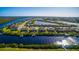 Wide aerial view of a waterfront community with canal access and stunning water views at 15048 Spanish Point Dr, Port Charlotte, FL 33981