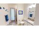 Well-lit bathroom with granite counters, tile flooring, and walk in shower at 15048 Spanish Point Dr, Port Charlotte, FL 33981