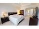 Spacious bedroom with carpeted floors, and dark wood furniture at 15048 Spanish Point Dr, Port Charlotte, FL 33981