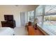 Relaxing bedroom featuring a sunny window seat and a view to the pool area at 15048 Spanish Point Dr, Port Charlotte, FL 33981