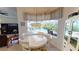 Charming breakfast nook with views of the pool area and plenty of natural light at 15048 Spanish Point Dr, Port Charlotte, FL 33981