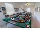 Spacious game room with a large model train set and walls decorated with pictures at 15048 Spanish Point Dr, Port Charlotte, FL 33981