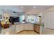 Modern kitchen with granite countertops, stainless steel appliances, and an island with a sink at 15048 Spanish Point Dr, Port Charlotte, FL 33981