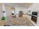 Bright kitchen featuring white cabinets, granite countertops, and stainless steel appliances at 15048 Spanish Point Dr, Port Charlotte, FL 33981