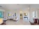 Bright living room featuring tile flooring, comfortable seating and archway access at 15048 Spanish Point Dr, Port Charlotte, FL 33981