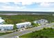 Aerial showing community proximity to water and road at 3929 Cape Haze Dr # 105, Rotonda West, FL 33947