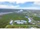 Aerial view of waterfront community with multiple buildings and lush landscaping at 3929 Cape Haze Dr # 105, Rotonda West, FL 33947
