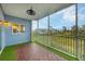 Screened balcony with artificial turf and wood-look tile flooring at 3929 Cape Haze Dr # 105, Rotonda West, FL 33947