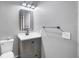 Modern bathroom with gray vanity, white countertop, and a black accent at 3929 Cape Haze Dr # 105, Rotonda West, FL 33947