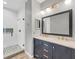 Modern bathroom with stylish fixtures, double vanity, and glass shower at 3929 Cape Haze Dr # 105, Rotonda West, FL 33947