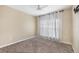 Spacious bedroom with carpeted floors, ceiling fan, and large windows at 3929 Cape Haze Dr # 105, Rotonda West, FL 33947